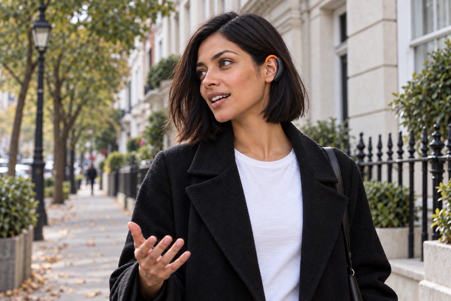A woman talks through an idea on a city walk.