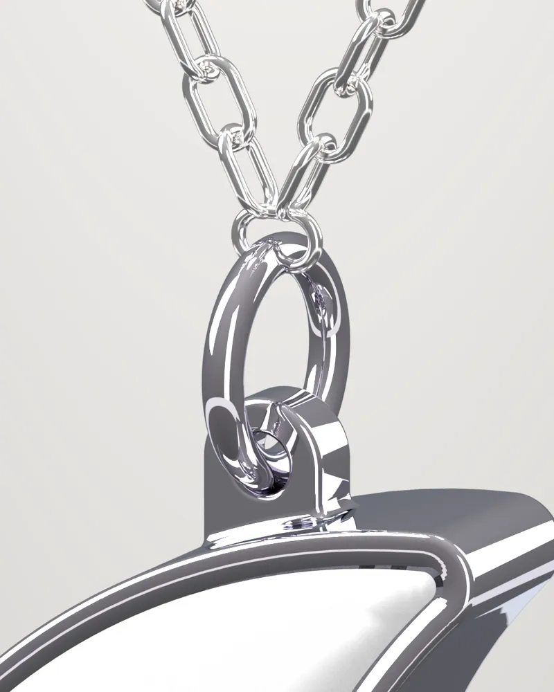 Detail: the jump ring through the lug, threaded on a fine cable chain.